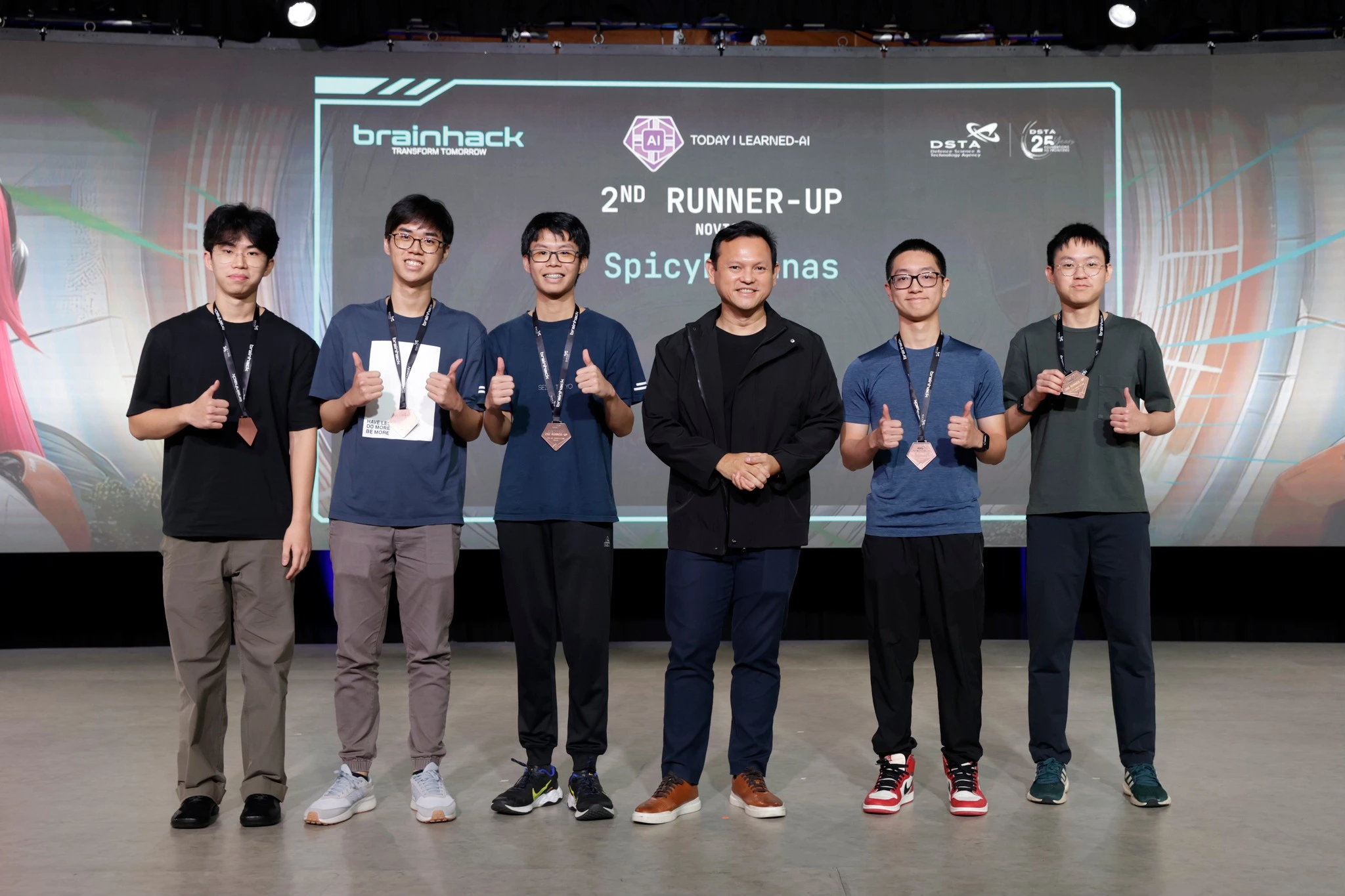 Picture of my team and I receiving the BrainHack 2025 TILAI - 2nd Runner Up award