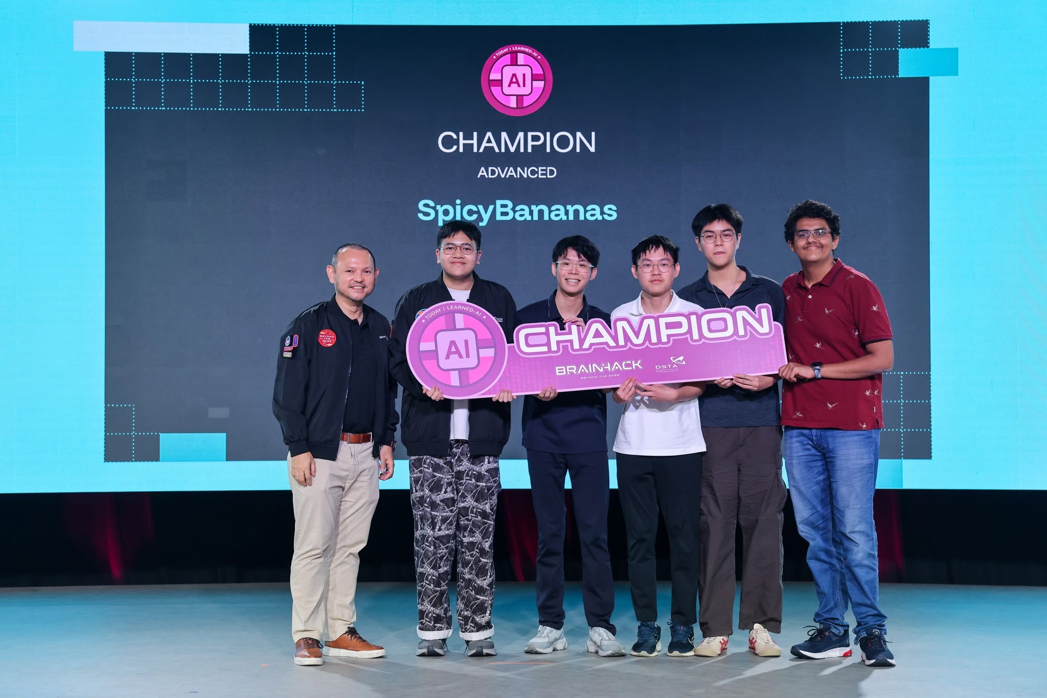 My team and me receiving the DSTA BrainHack 2026 TIL-AI Advanced Champion award